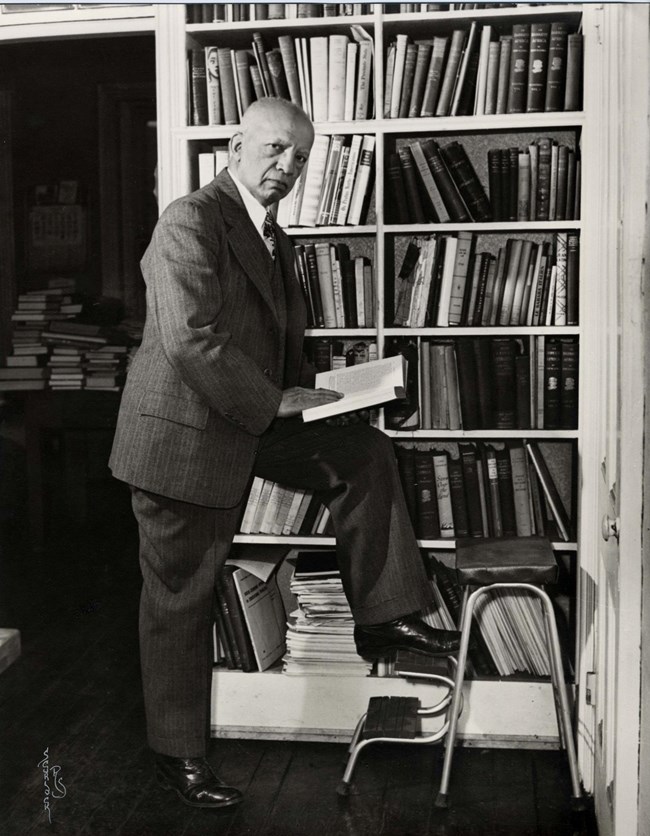 Carter G. Woodson in his Library