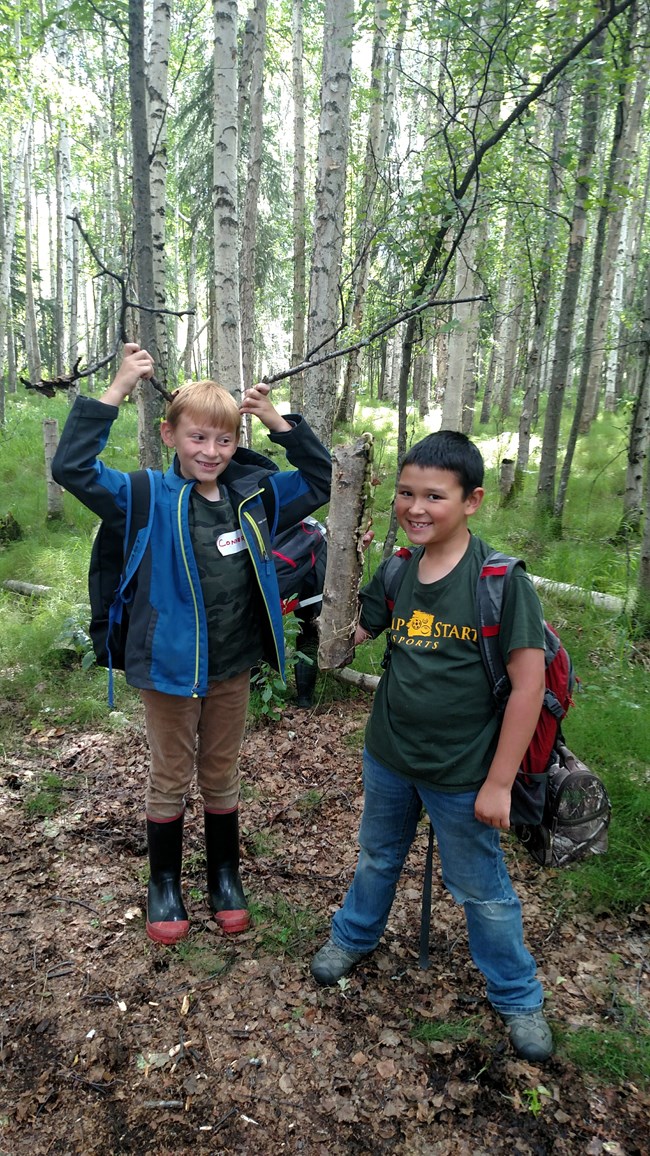 two kids in a forest