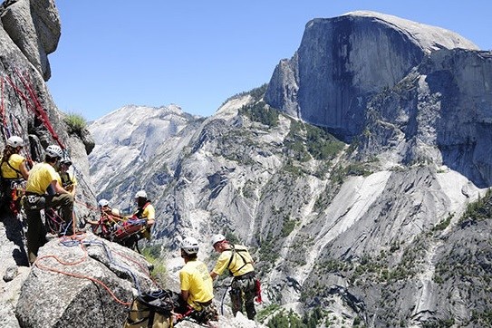 Hiker being rescued by Yosemite Search and Rescue after becoming stranded on a cliff ledge