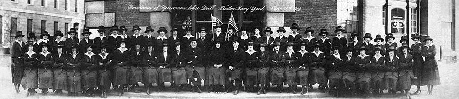 Grainy photo of scores of women in naval uniforms standing in rows for a portrait.