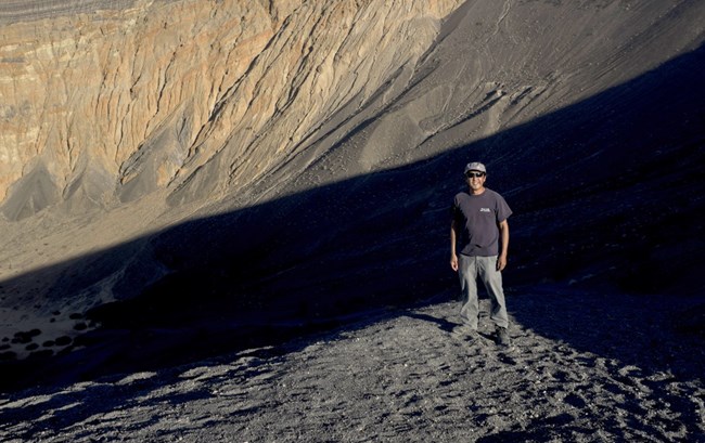 Zak Wood standing on the Ubehebe Crater at Death Valley National Park.