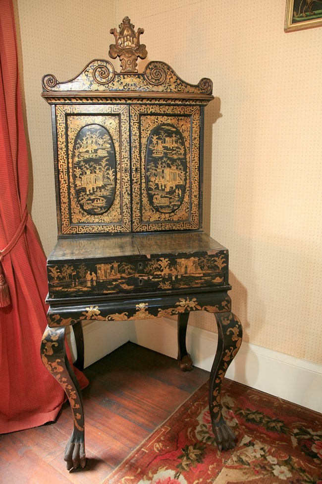 Photo of black lacquer and gilt sewing cabinet.