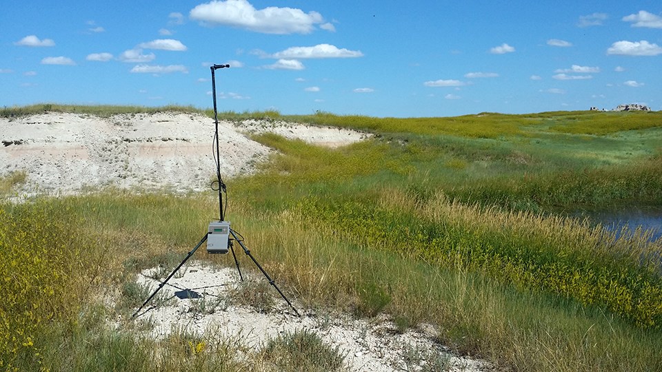 An acoustic monitoring station set up by a stock pond