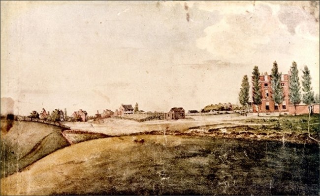 aftermath-octagon An image of a small town with a green field. A larger brick building in on the right.