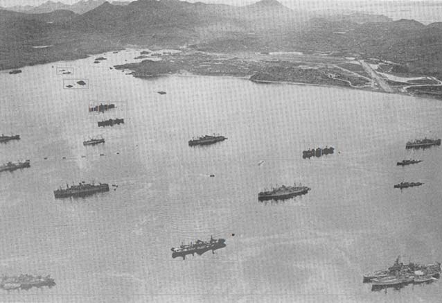 aerial view of world war two era ships in a harbor