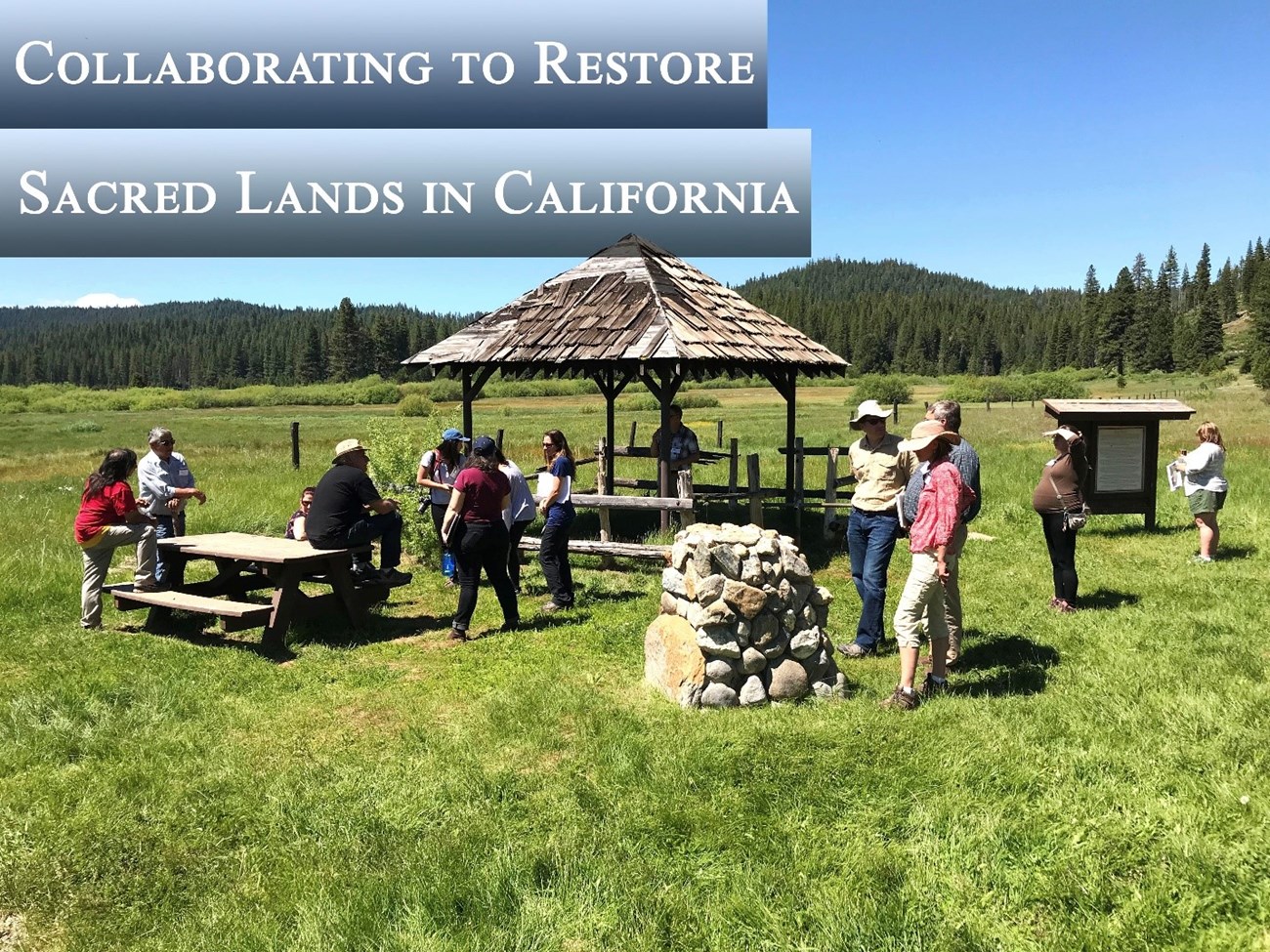 Group of people standing around an interpretive site. NPS Photo Group of people standing around an interpretive site. NPS Photo