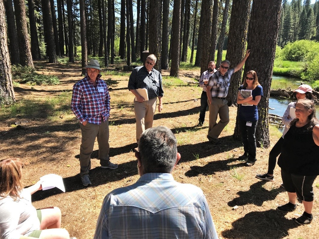 Ken Holbrook (pictured in the hat) leads the workshop design team on a tour of the site, National Park Service photo. Ken Holbrook (pictured in the hat) leads the workshop design team on a tour of the site, National Park Service photo.