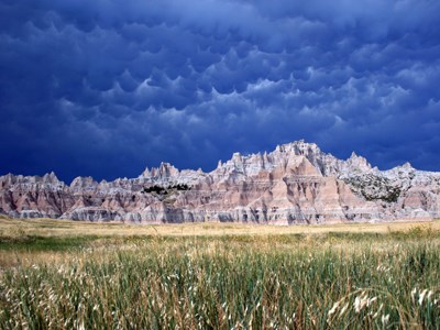 A scenic view of Badlands National Park, its unique land forms in the distance