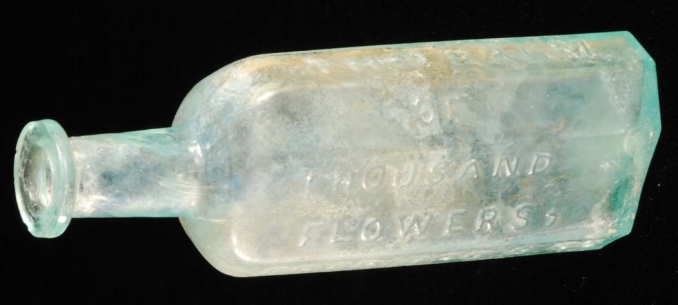 Balm of a Thousand Flowers Glass bottle with raised lettering