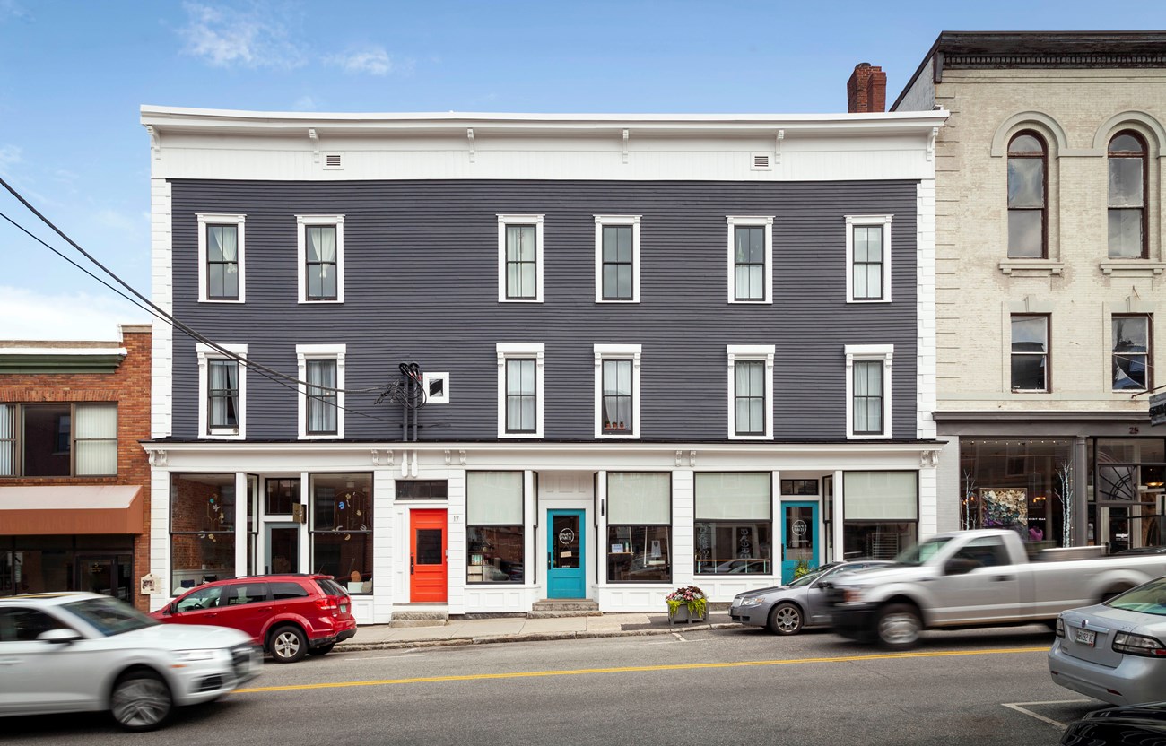 A three story wood and masonry building in downtown