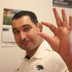 bonde 1 scientist holding small fossil