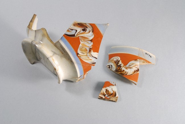 Three bowl fragments with swirling design