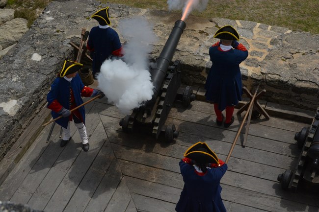 Cannon being fired by Spanish crew.