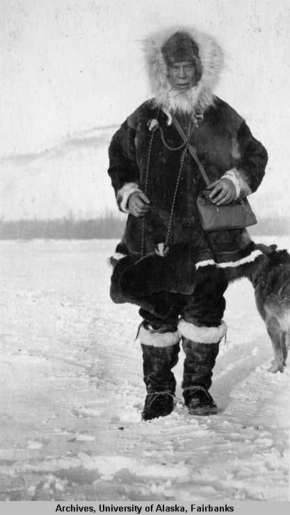 historic image of a man dressed in warm clothes in the snow