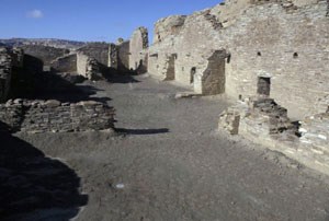 [photo] Ruins of masonry buildings in desert valley.