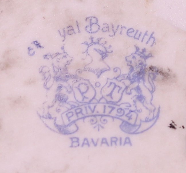 A painted porcelain crest that says "___yal Bayreuth P T Priv. 1794 Bavaria"