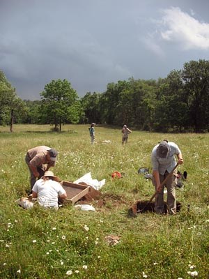 Archeologists excavate.