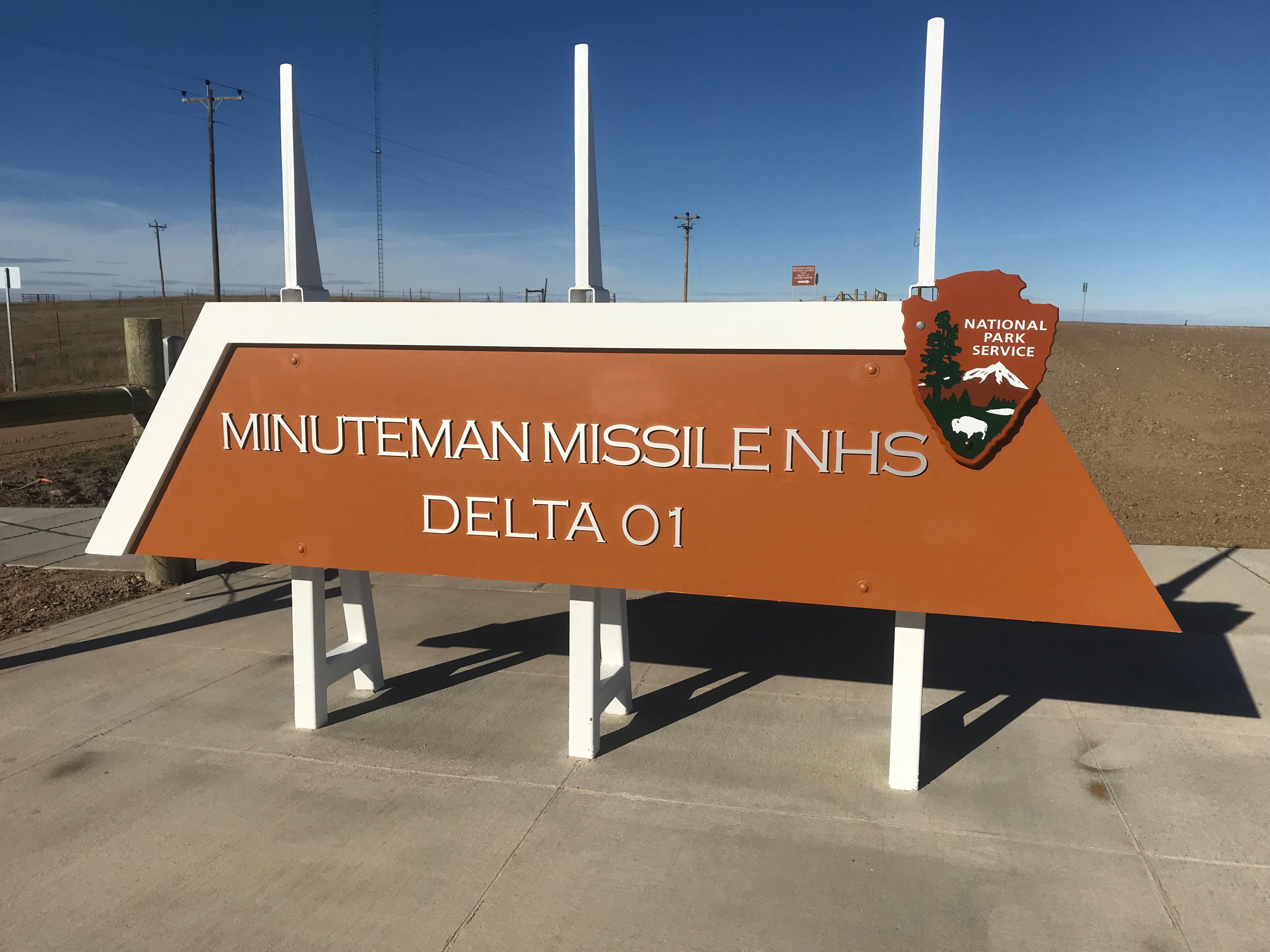 Brown and white entry sign at Delta-01