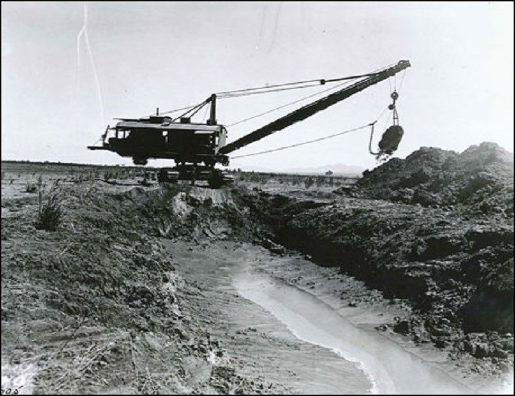 Crane moving dirt. (National Archives and Records Administration; photographer unknown)