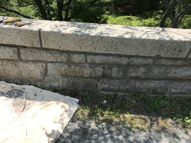 new mortar joints in gray stone bridge
