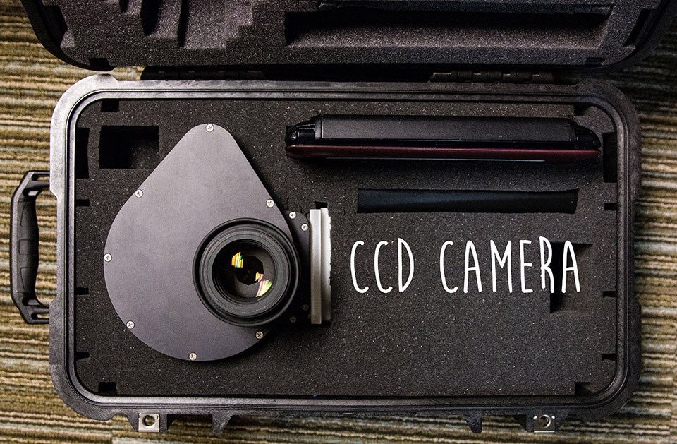 teardrop shaped camera inside a large padded briefcase
