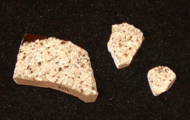 Encrusted slipware Three fragments of ceramic with rough surface