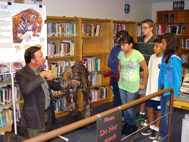 scientist talking to students