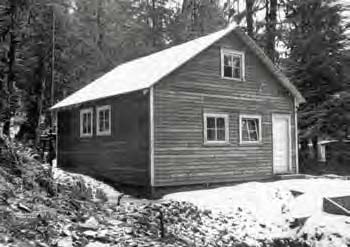 Black and white photo of a small house.