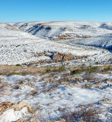 A light covering of snow on the desert