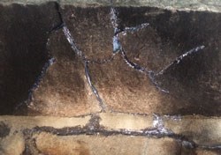 Filled cracks in granite close of up granite with apoxy in cracks
