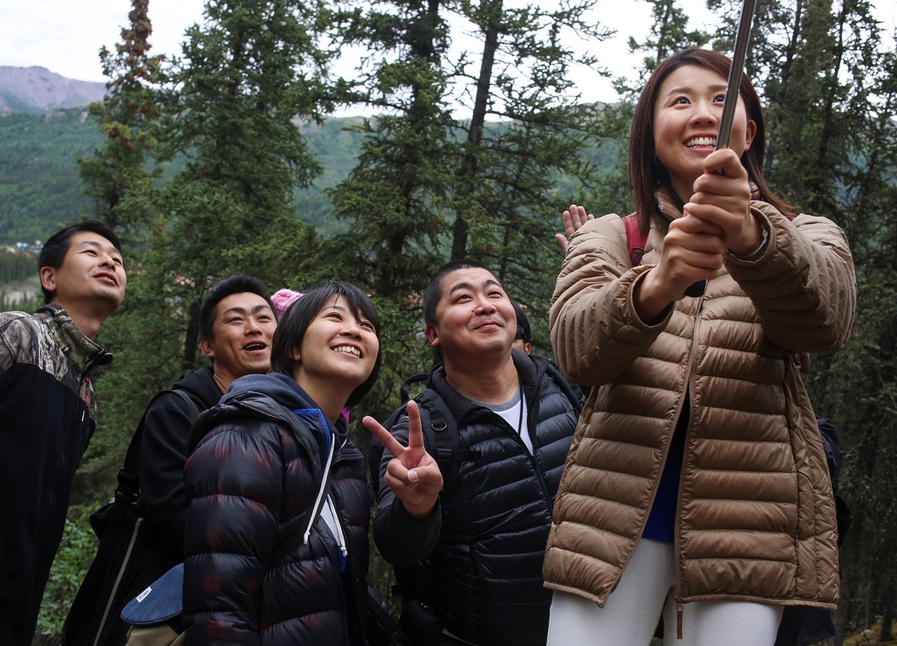 keep safety in the picture group poses for selfie
