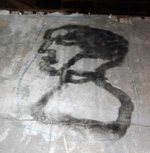 Photo of plaster with charred image. Photo of plaster with charred image.