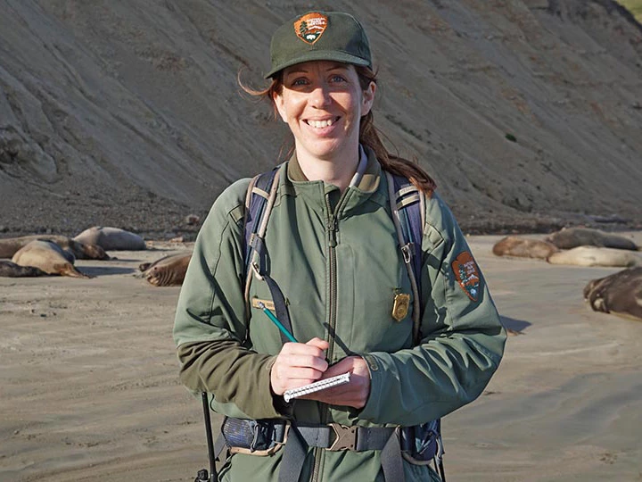 fxDSC00436 Portrait of Marine Ecologist Sarah Codde, smiling while surveying elephant seals on Drake's beach in Point Reyes.