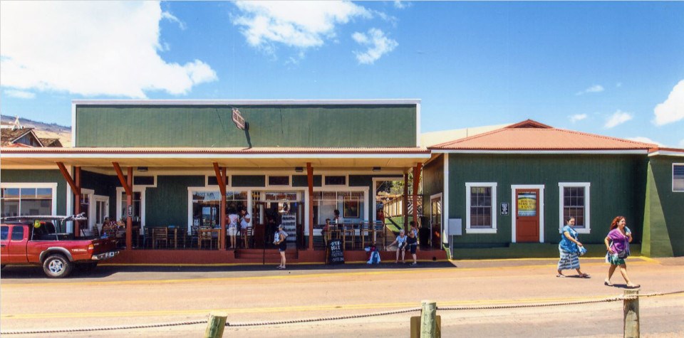 Exterior of general store with people on porch
