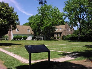 Memorial House and outbuilding with building footprint in foreground. Memorial House and outbuilding with building footprint in foreground.