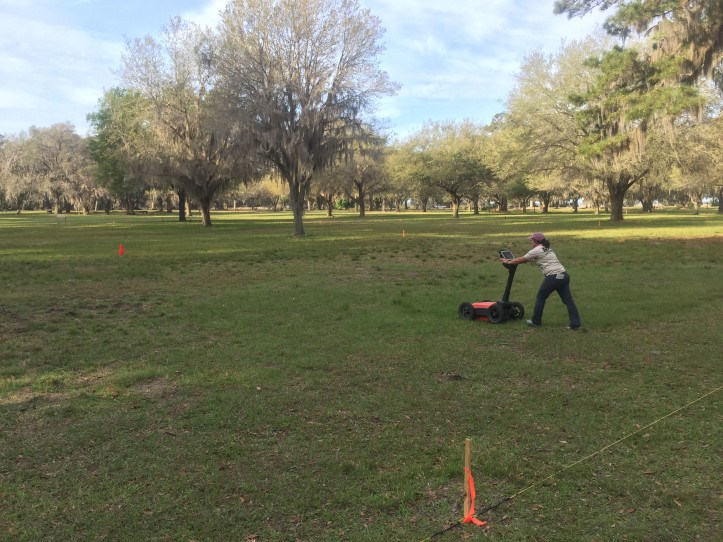 SEAC archeologist Michelle Gray surveying a grid with the GPR unit. SEAC archeologist Michelle Gray surveying a grid with the GPR unit.
