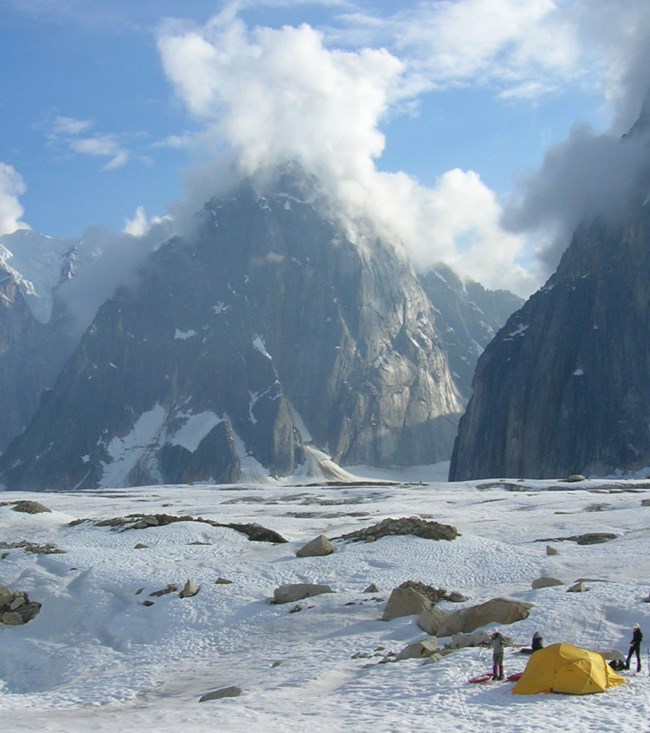 campsite with ice, snow, and rock spires