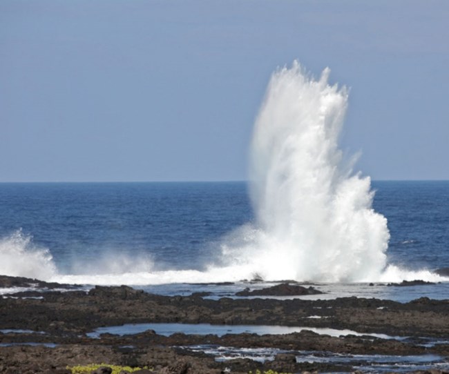 wave breaking on volcanic rocks