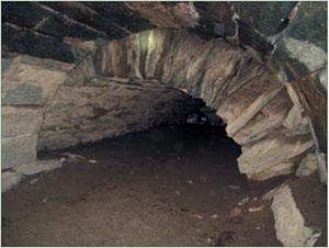 Inside of tunnel where two styles of construction meet.