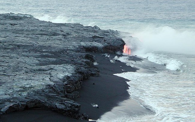 lava and black sand on beach