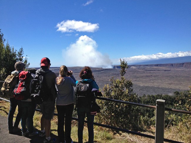 Visotors watch a steam plume from the Jagger Visitor center at Hawaii Volcanoes NP Visotors watch a steam plume from the Jagger Visitor center at Hawaii Volcanoes NP