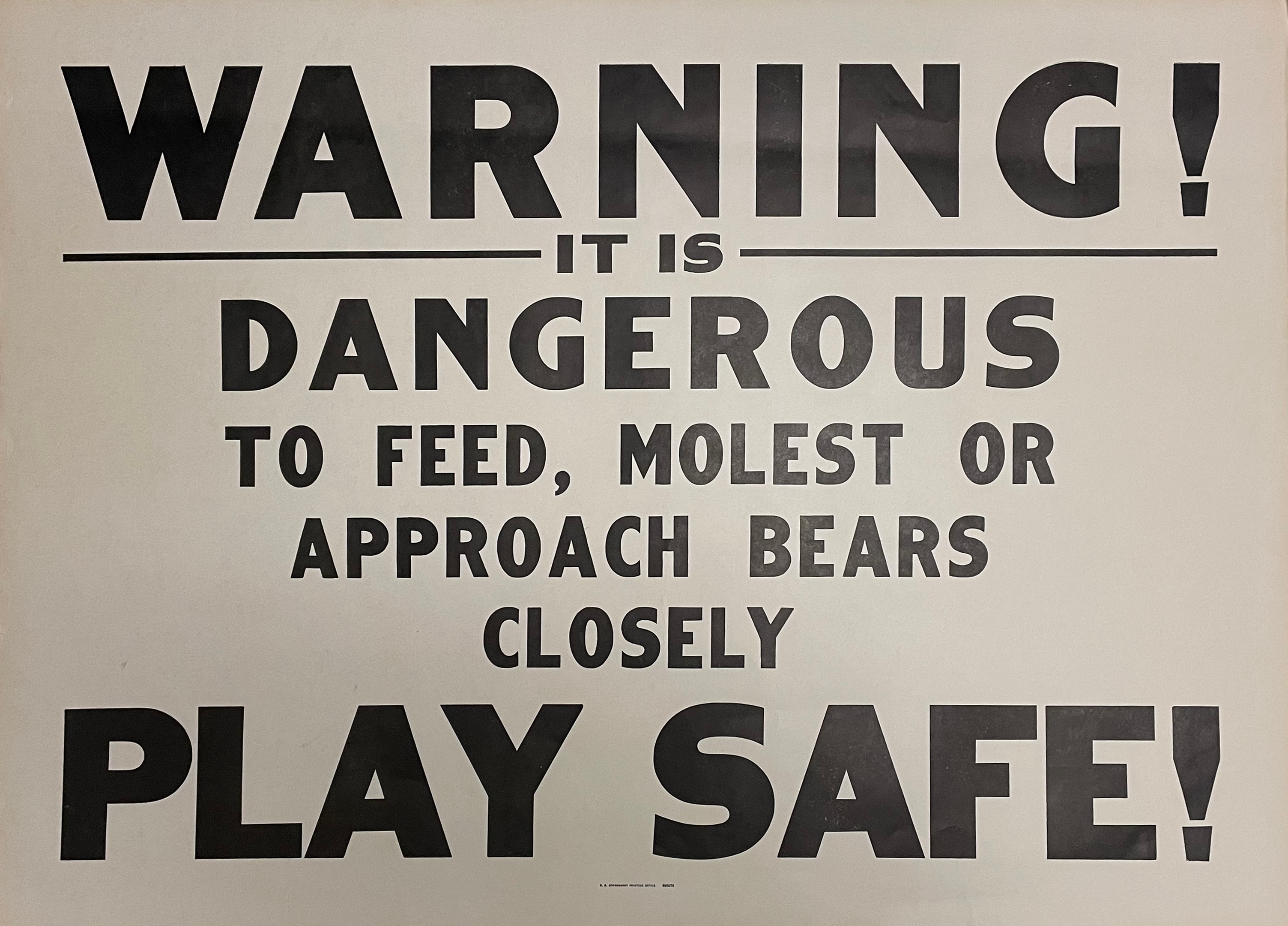 Poster with text warning of feeding or molesting bears