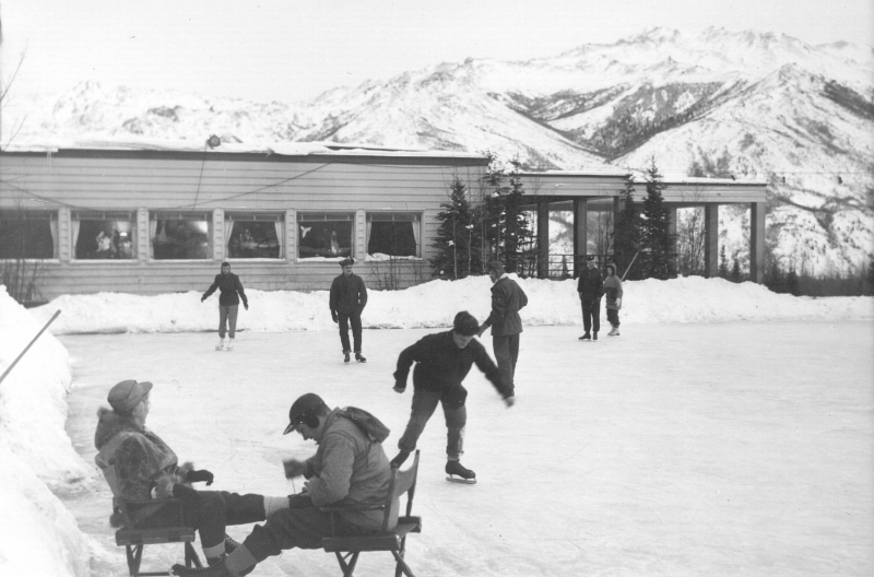 people ice skating outside a hotel