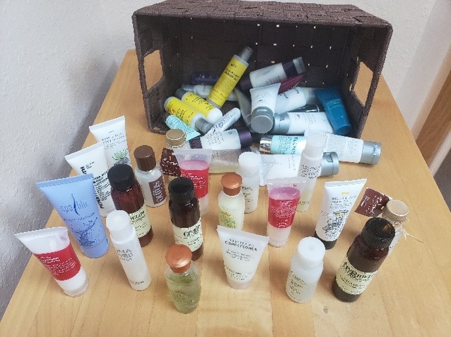 basket of hotel lotion and shampoo bottles basket of hotel lotion and shampoo bottles