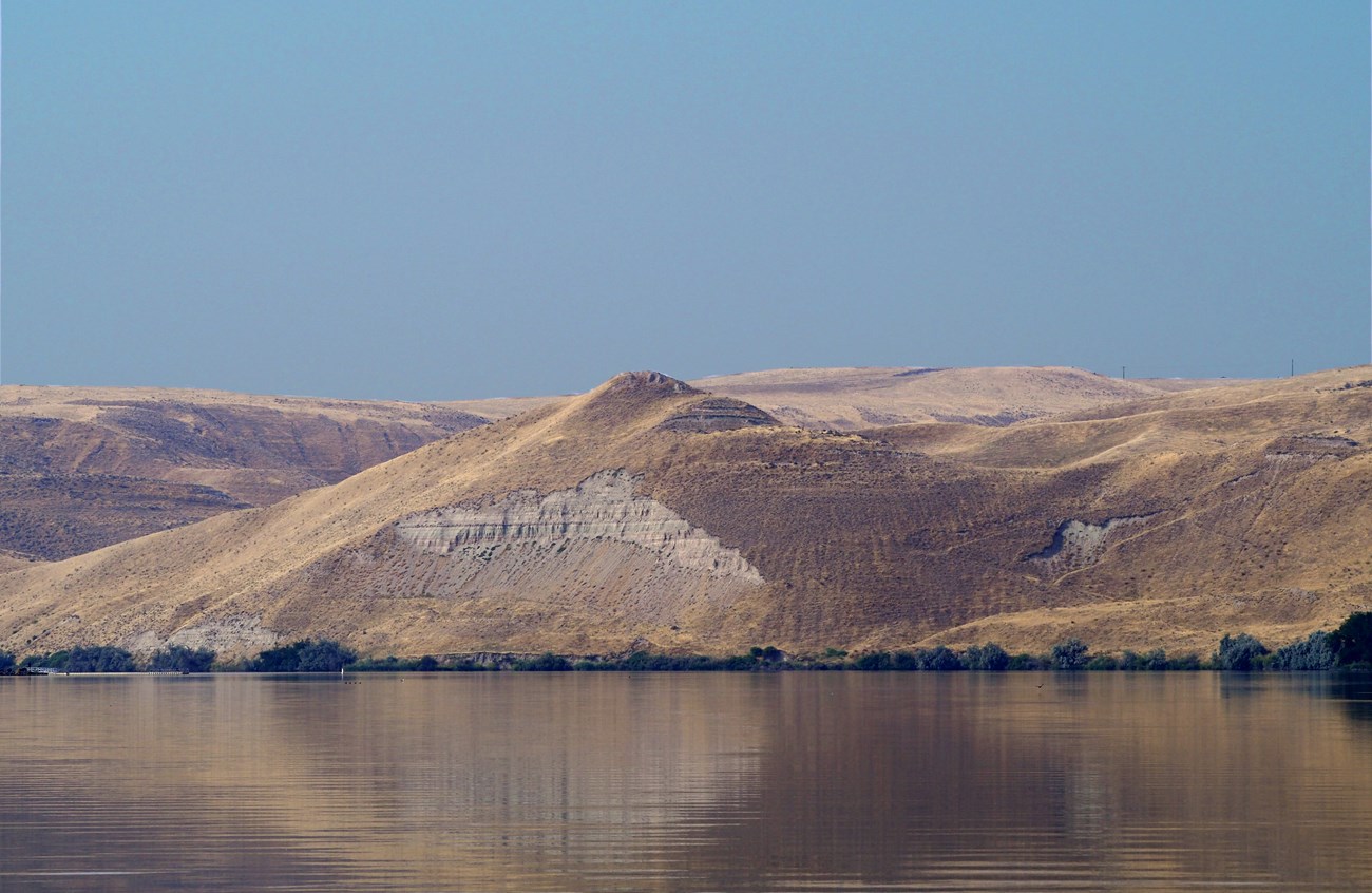 view of river with hills beyond