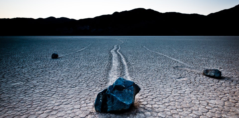 Boulders leave a mysterious trail in a dry lakebed