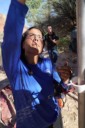 Jessica Rosado helps set up a mist net to capture bats at Glen Canyon National Recreation Area. Jessica Rosado helps set up a mist net to capture bats at Glen Canyon National Recreation Area.