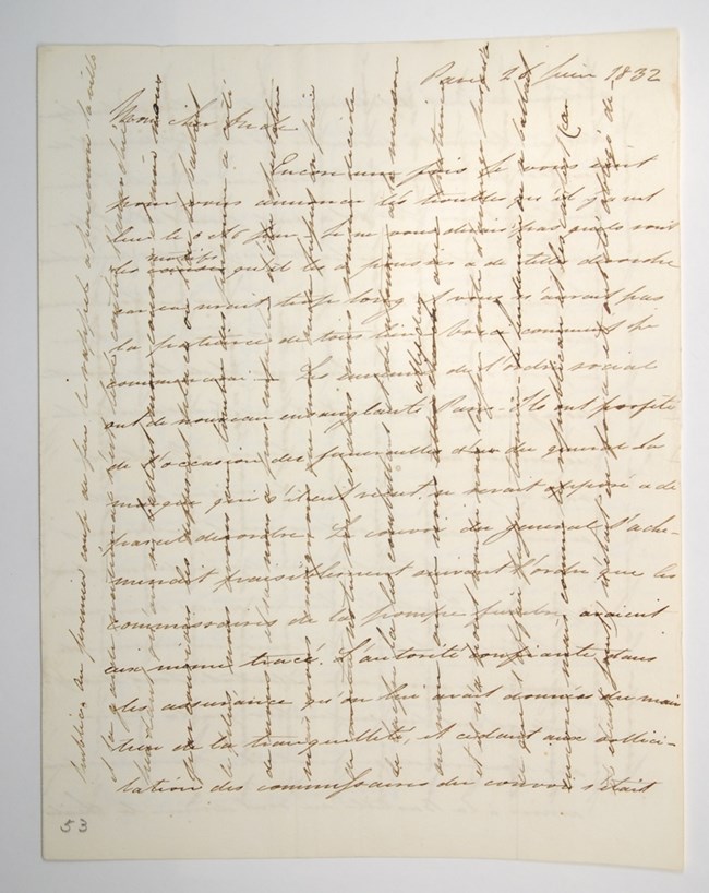 Handwritten letter with criss-crossing lines of text