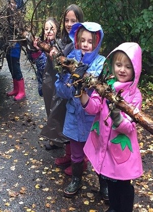 Kids holding a tree