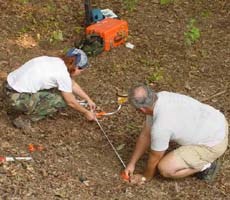 Archeologists measuring